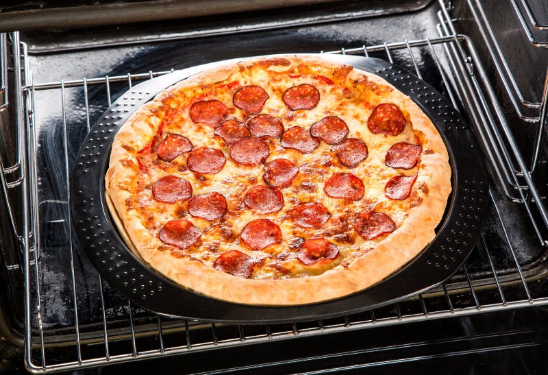 Pepperoni Pizza in the Oven. Stock Photo Image of line, cuisine 42216502