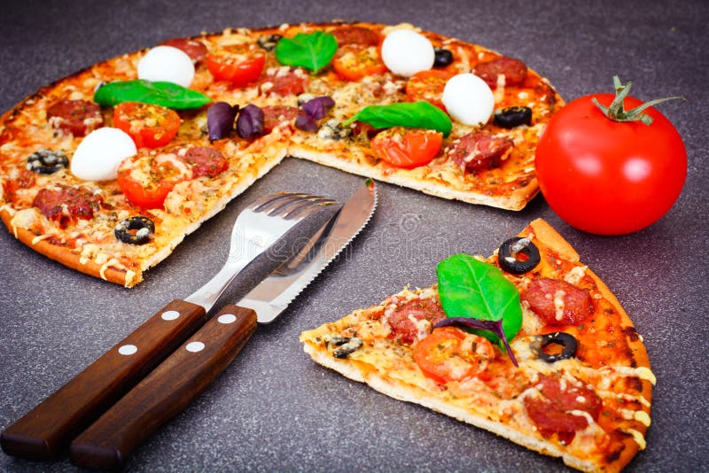 Pepperoni Pizza with Sausage, Cheese, Mozzarella, Olives and Basil