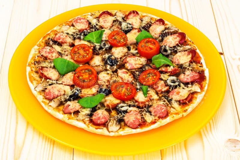 Pepperoni Pizza with Sausage, Cheese, Mozzarella, Olives and Basil