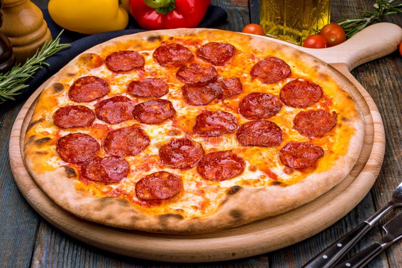 Pepperoni pizza on plate stock image. Image of table - 121078911