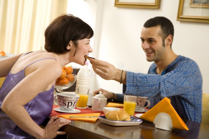 Healthy living: young couple having breakfast at home. Healthy living: young couple having breakfast at home