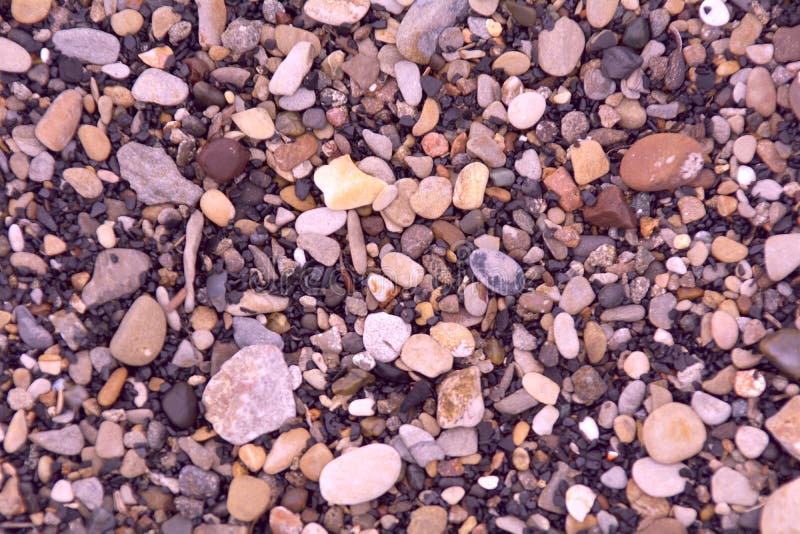 Pequeñas piedras del mar o del río imagen de archivo libre de regalías Pequeñas piedras del mar o del río imagen de archivo libre de regalías