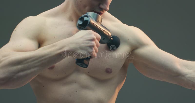 Professional Massage Chest Pectoral Muscles Percussion Shock Wave Massager  Professional Stock Photo by ©YAY_Images 618650170