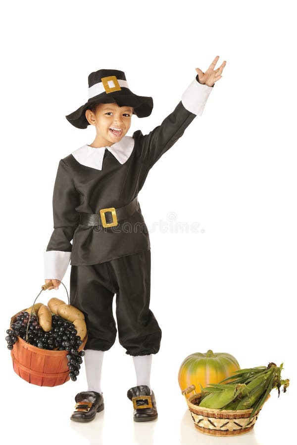 An adorable preschooler in a Pilgrim costume, waving hello with baskets full of fruits and veggies nearby. Isolated on white. An adorable preschooler in a Pilgrim costume, waving hello with baskets full of fruits and veggies nearby. Isolated on white.