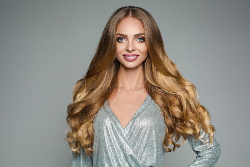 Perfect attractive woman with thick smooth hair in silver festiv royalty free stock photo Perfect attractive woman with thick smooth hair in silver festiv royalty free stock photo