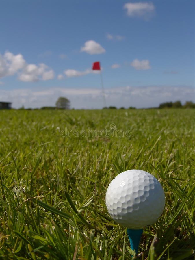 Higher view of golfball and peg. Hole can be seen in the background. Day game drive stock images, royalty-free photos and pictures