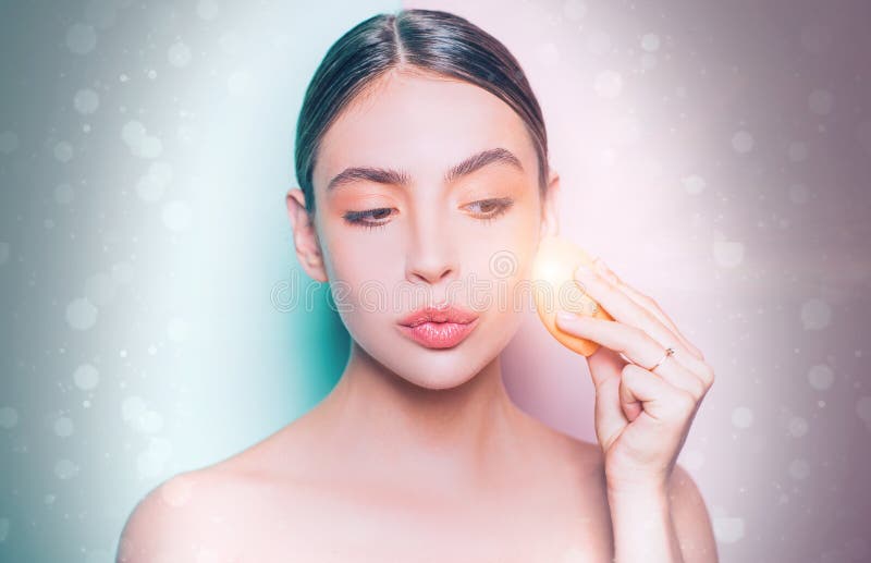 Perfect skin tone. Apply concealer and cosmetic highlighter. Girl hold cosmetic applicator. Woman spreading cream on her royalty free stock images Perfect skin tone. Apply concealer and cosmetic highlighter. Girl hold cosmetic applicator. Woman spreading cream on her royalty free stock images