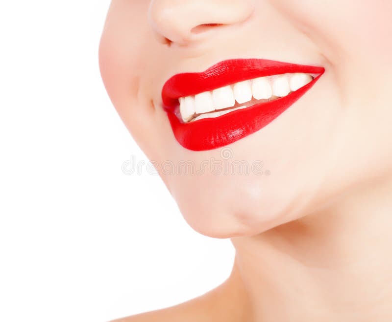 Photo of perfect girls smile, closeup of female face part isolated on white background, red lipstick, dental health care, healthy teeth, tooth whitening, stomatology clinic, dentistry concept. Photo of perfect girls smile, closeup of female face part isolated on white background, red lipstick, dental health care, healthy teeth, tooth whitening, stomatology clinic, dentistry concept