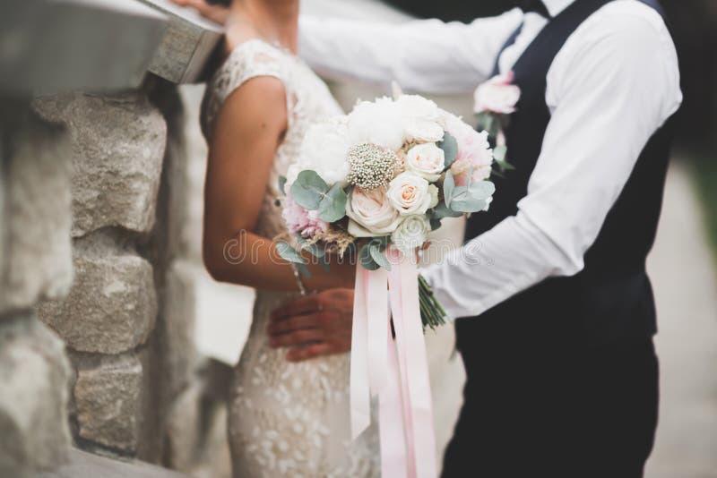Perfect wedding couple holding luxury bouquet of flowers royalty free stock image Perfect wedding couple holding luxury bouquet of flowers royalty free stock image
