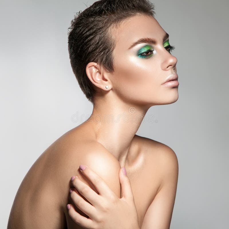 Perfect young woman with beautiful makeup and short hair looking royalty free stock images Perfect young woman with beautiful makeup and short hair looking royalty free stock images