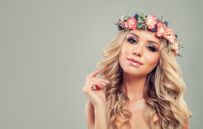 Perfect Young Woman with Flowers Hairstyle.