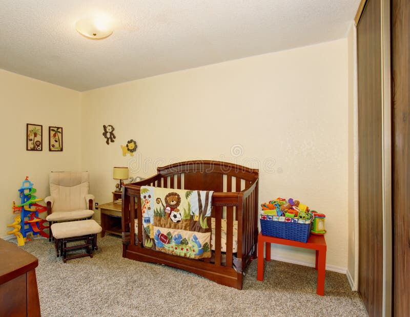 Perfect baby room with excellent wooden crib, carpet, and white walls. Perfect baby room with excellent wooden crib, carpet, and white walls.