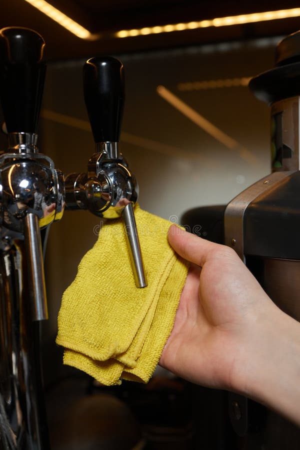 A Perfectly Lit Cleaning Cloth Sat upon an Espresso Machine. Stock