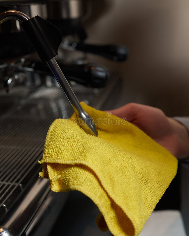 A Perfectly Lit Cleaning Cloth Sat upon an Espresso Machine. Stock