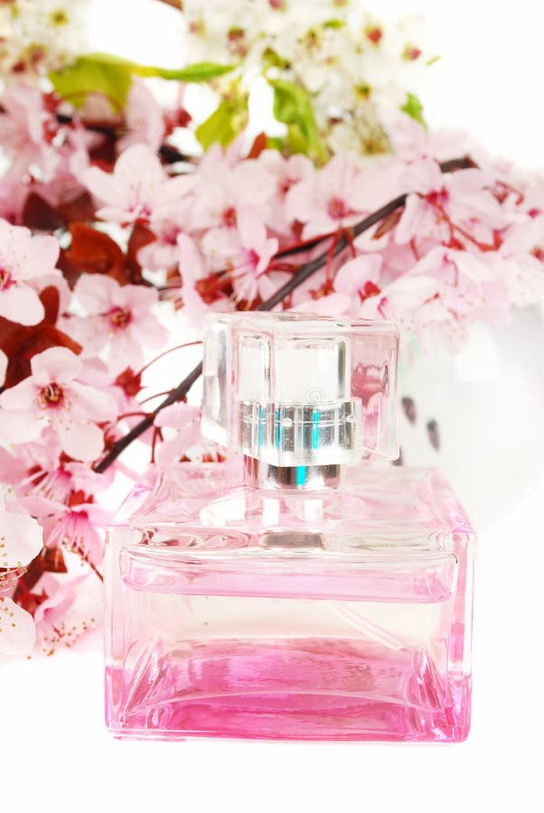 Perfume bottle with cherry blossom background.