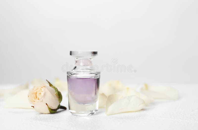 Perfume Bottle and Flower on Table Stock Image - Image of bottle 
