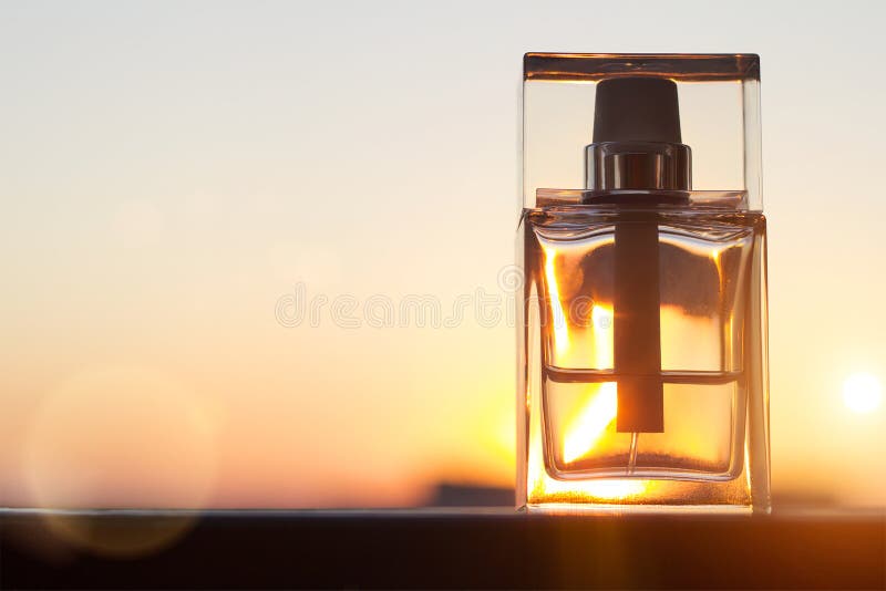 Perfume Bottle on Gold Sunset Background with Copy Space. Stock Image ...