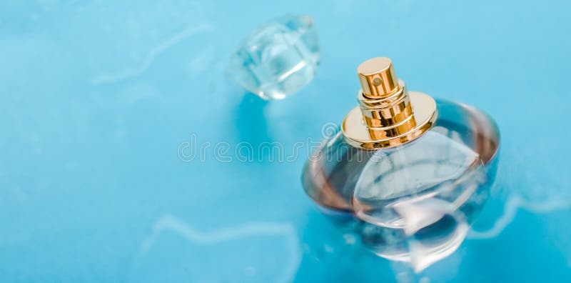 Perfume bottle under blue water, fresh sea coastal scent as glamour fragrance and eau de parfum product as holiday gift, luxury. Perfumery, cosmetics and stock photography Perfume bottle under blue water, fresh sea coastal scent as glamour fragrance and eau de parfum product as holiday gift, luxury. Perfumery, cosmetics and stock photography