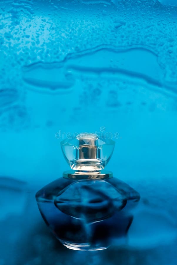 Perfume bottle under blue water, fresh sea coastal scent as glamour fragrance and eau de parfum product as holiday gift, luxury. Perfumery, cosmetics and stock photo Perfume bottle under blue water, fresh sea coastal scent as glamour fragrance and eau de parfum product as holiday gift, luxury. Perfumery, cosmetics and stock photo