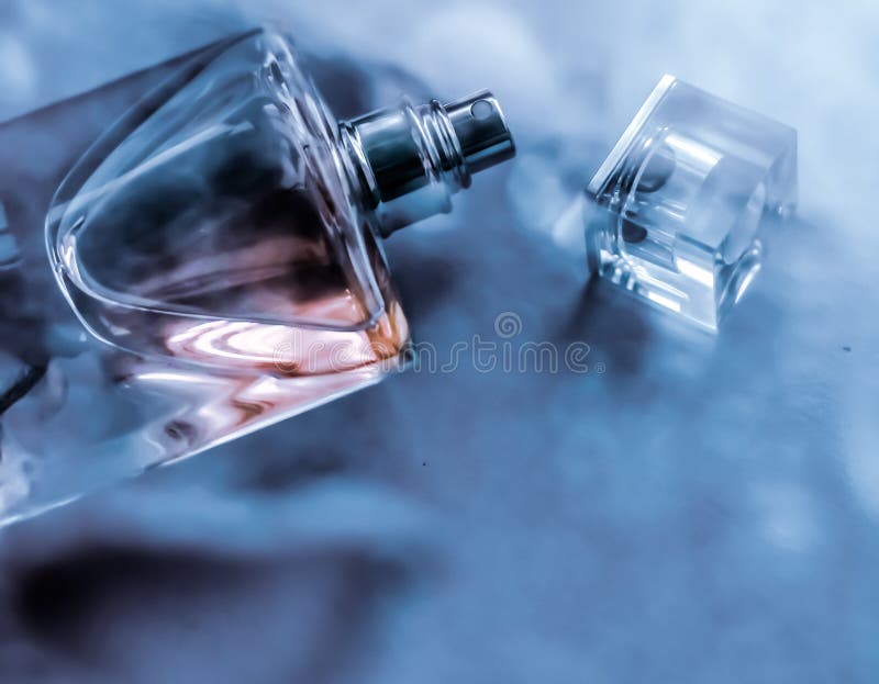 Perfume bottle under blue water, fresh sea coastal scent as glamour fragrance and eau de parfum product as holiday gift, luxury. Perfumery, cosmetics and royalty free stock photos Perfume bottle under blue water, fresh sea coastal scent as glamour fragrance and eau de parfum product as holiday gift, luxury. Perfumery, cosmetics and royalty free stock photos