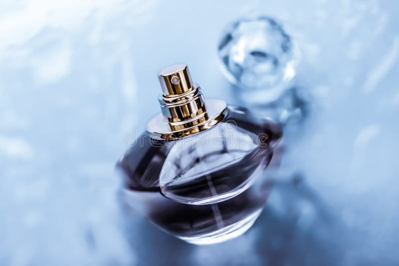 Perfume bottle under blue water, fresh sea coastal scent as glamour fragrance and eau de parfum product as holiday gift, luxury. Perfumery, cosmetics and stock photography Perfume bottle under blue water, fresh sea coastal scent as glamour fragrance and eau de parfum product as holiday gift, luxury. Perfumery, cosmetics and stock photography