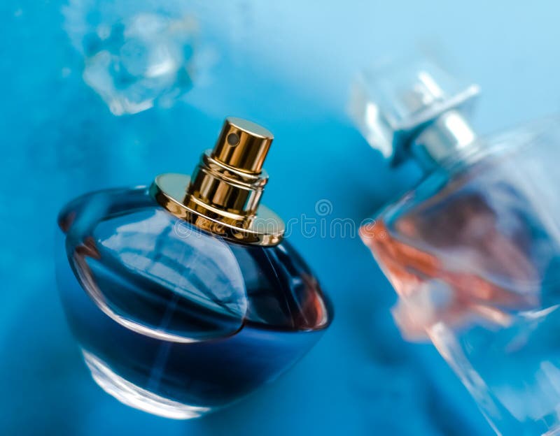 Perfume bottle under blue water, fresh sea coastal scent as glamour fragrance and eau de parfum product as holiday gift, luxury. Perfumery, cosmetics and stock image Perfume bottle under blue water, fresh sea coastal scent as glamour fragrance and eau de parfum product as holiday gift, luxury. Perfumery, cosmetics and stock image