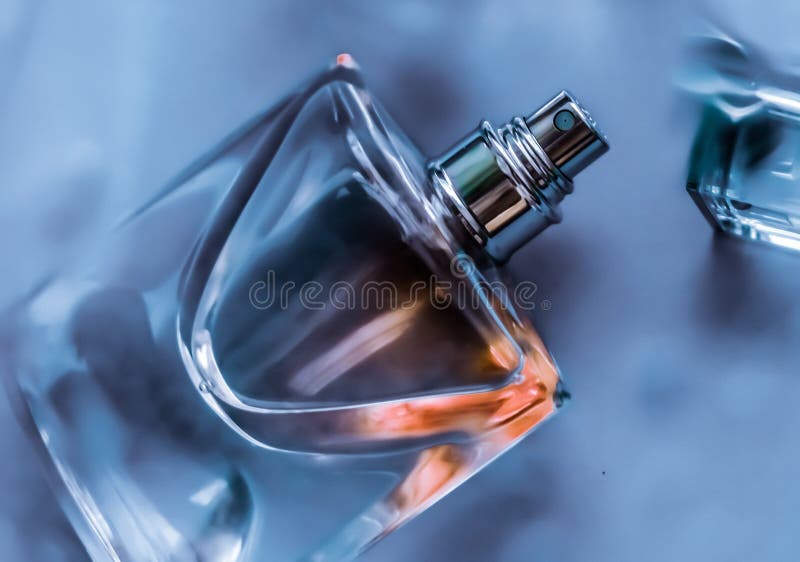 Perfume bottle under blue water, fresh sea coastal scent as glamour fragrance and eau de parfum product as holiday gift, luxury. Perfumery, cosmetics and royalty free stock images Perfume bottle under blue water, fresh sea coastal scent as glamour fragrance and eau de parfum product as holiday gift, luxury. Perfumery, cosmetics and royalty free stock images