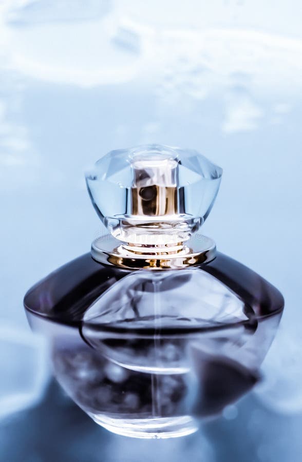 Perfume bottle under blue water, fresh sea coastal scent as glamour fragrance and eau de parfum product as holiday gift, luxury. Perfumery, cosmetics and stock image Perfume bottle under blue water, fresh sea coastal scent as glamour fragrance and eau de parfum product as holiday gift, luxury. Perfumery, cosmetics and stock image