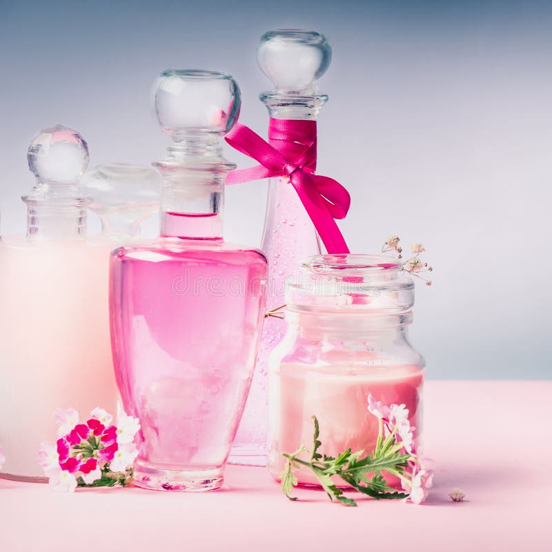 Perfume and Cosmetics setting on pastel light background, front view royalty free stock images Perfume and Cosmetics setting on pastel light background, front view royalty free stock images