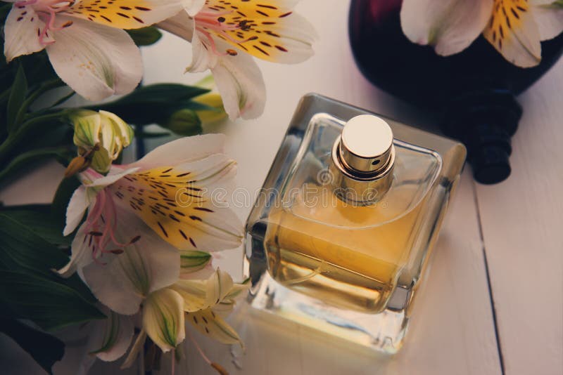 Perfume with flowers stock photo. Image of cosmetic, personal 77563504