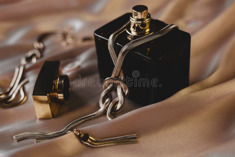 Perfume and gold jewelry stock image. Image of house 94075191