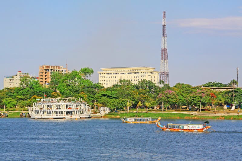 Hue Perfume River Riverbank And Tourist Boat, Vietnam. The Perfume River is a river that crosses the city of Hue royalty free stock photo Hue Perfume River Riverbank And Tourist Boat, Vietnam. The Perfume River is a river that crosses the city of Hue royalty free stock photo