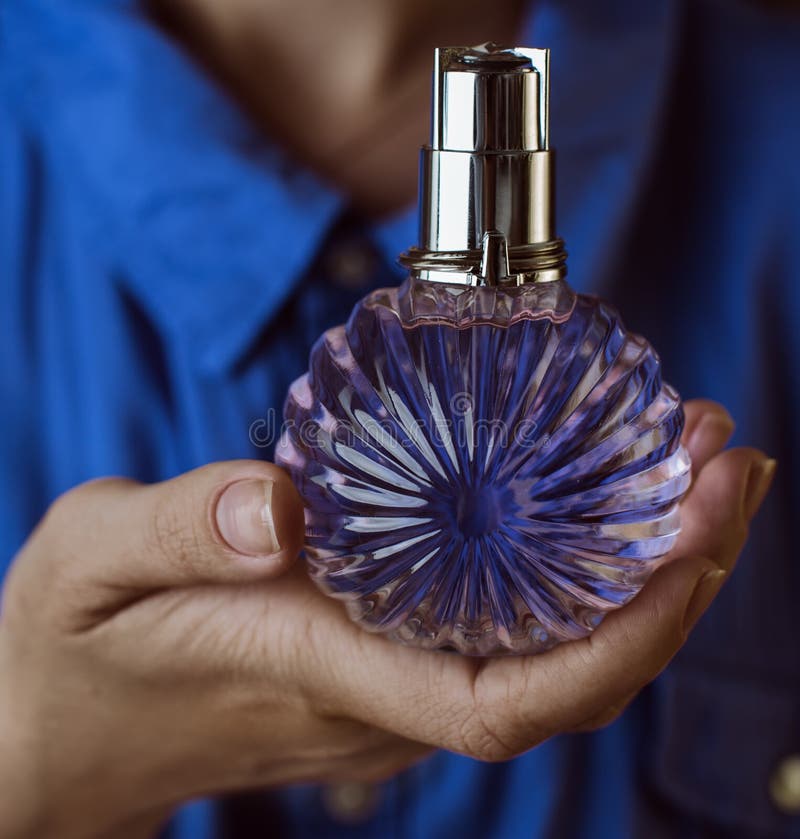Perfume in women s hands stock photo. Image of fruity 71529536