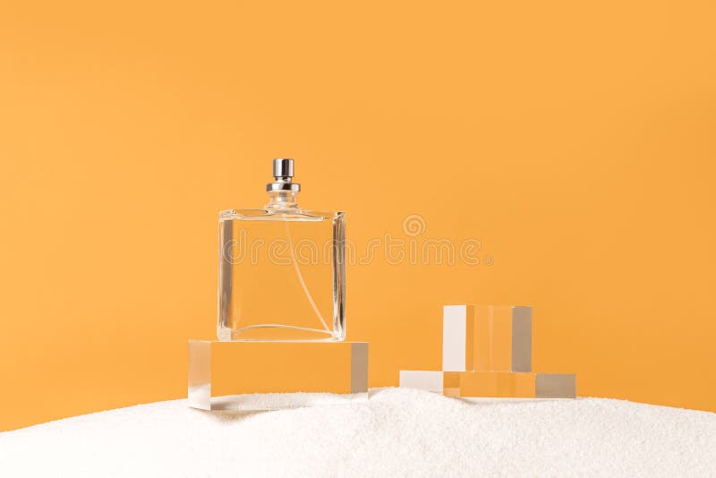 Perfumery background with transparent perfume bottle royalty free stock images