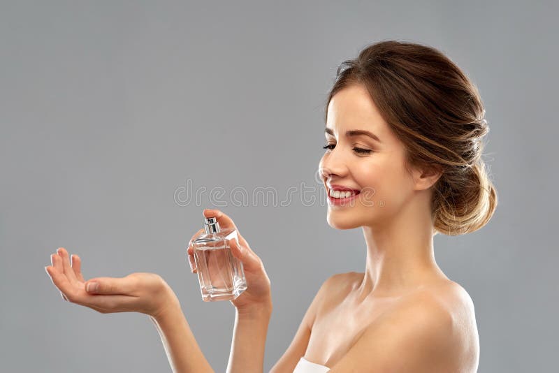 Happy Woman with Perfume Over Gray Background Stock Image - Image of  person, gorgeous: 139087317