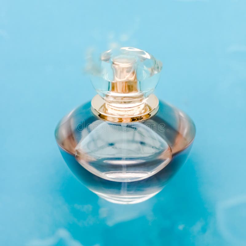 Perfume bottle under blue water, fresh sea coastal scent as glamour fragrance and eau de parfum product as holiday gift, luxury. Perfumery, cosmetics and stock photos Perfume bottle under blue water, fresh sea coastal scent as glamour fragrance and eau de parfum product as holiday gift, luxury. Perfumery, cosmetics and stock photos