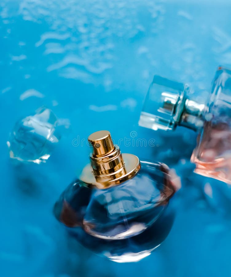 Perfume bottle under blue water, fresh sea coastal scent as glamour fragrance and eau de parfum product as holiday gift, luxury. Perfumery, cosmetics and stock images Perfume bottle under blue water, fresh sea coastal scent as glamour fragrance and eau de parfum product as holiday gift, luxury. Perfumery, cosmetics and stock images