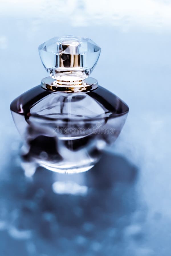 Perfume bottle under blue water, fresh sea coastal scent as glamour fragrance and eau de parfum product as holiday gift, luxury. Perfumery, cosmetics and stock photo Perfume bottle under blue water, fresh sea coastal scent as glamour fragrance and eau de parfum product as holiday gift, luxury. Perfumery, cosmetics and stock photo