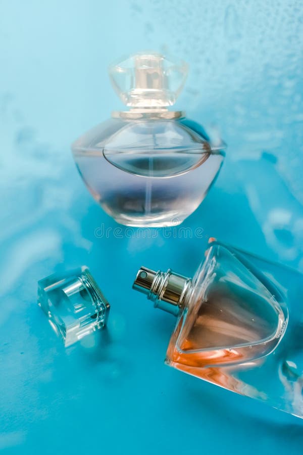 Perfume bottle under blue water, fresh sea coastal scent as glamour fragrance and eau de parfum product as holiday gift, luxury. Perfumery, cosmetics and royalty free stock photos Perfume bottle under blue water, fresh sea coastal scent as glamour fragrance and eau de parfum product as holiday gift, luxury. Perfumery, cosmetics and royalty free stock photos