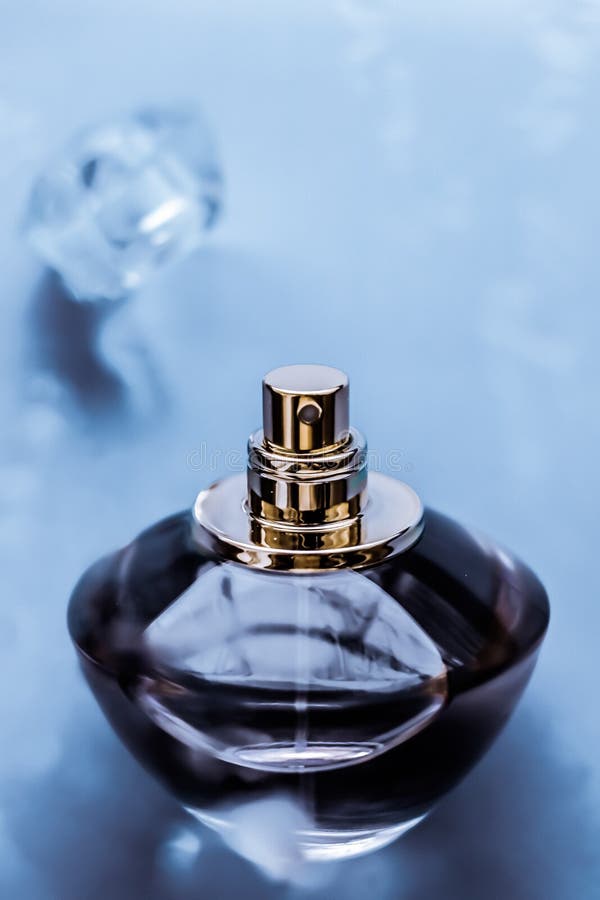Perfume bottle under blue water, fresh sea coastal scent as glamour fragrance and eau de parfum product as holiday gift, luxury. Perfumery, cosmetics and royalty free stock photos Perfume bottle under blue water, fresh sea coastal scent as glamour fragrance and eau de parfum product as holiday gift, luxury. Perfumery, cosmetics and royalty free stock photos