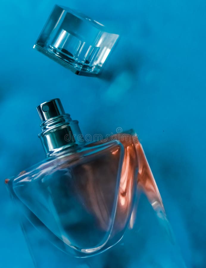 Perfume bottle under blue water, fresh sea coastal scent as glamour fragrance and eau de parfum product as holiday gift, luxury. Perfumery, cosmetics and stock images Perfume bottle under blue water, fresh sea coastal scent as glamour fragrance and eau de parfum product as holiday gift, luxury. Perfumery, cosmetics and stock images