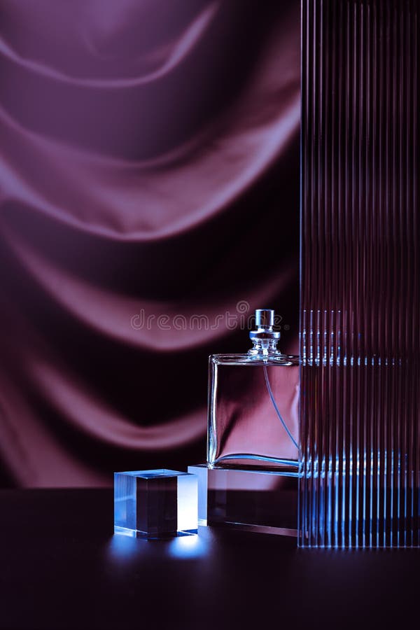 Perfumery elegant composition made with transparent perfume bottle on the table. stock images