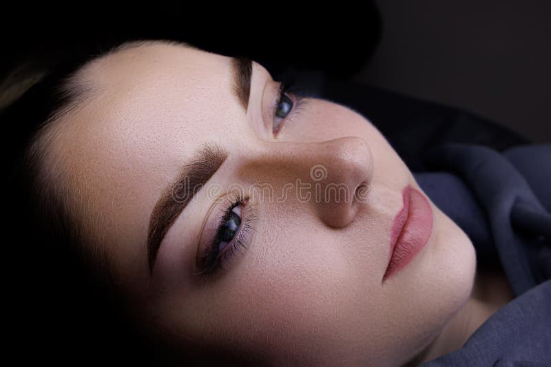 Permanent Makeup of Eyebrows, Girl Model with Permanent Makeup