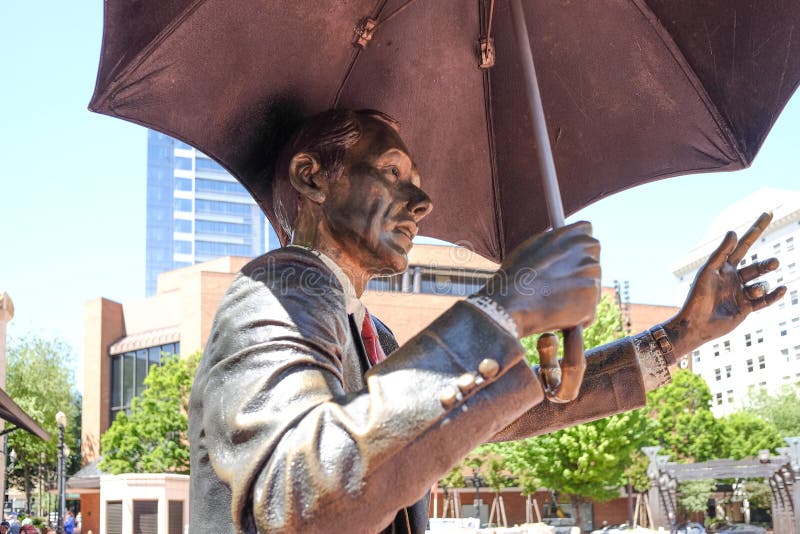 Portland, Oregon, May 6, 2016: Allow Me sculpture by John Seward Johnson II, in Pioneer Courthouse Square. Portland, Oregon, May 6, 2016: Allow Me sculpture by John Seward Johnson II, in Pioneer Courthouse Square