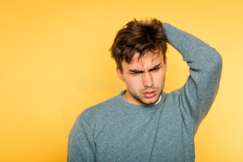 Perplexed baffled man scratch head look owlishly royalty free stock images Perplexed baffled man scratch head look owlishly royalty free stock images