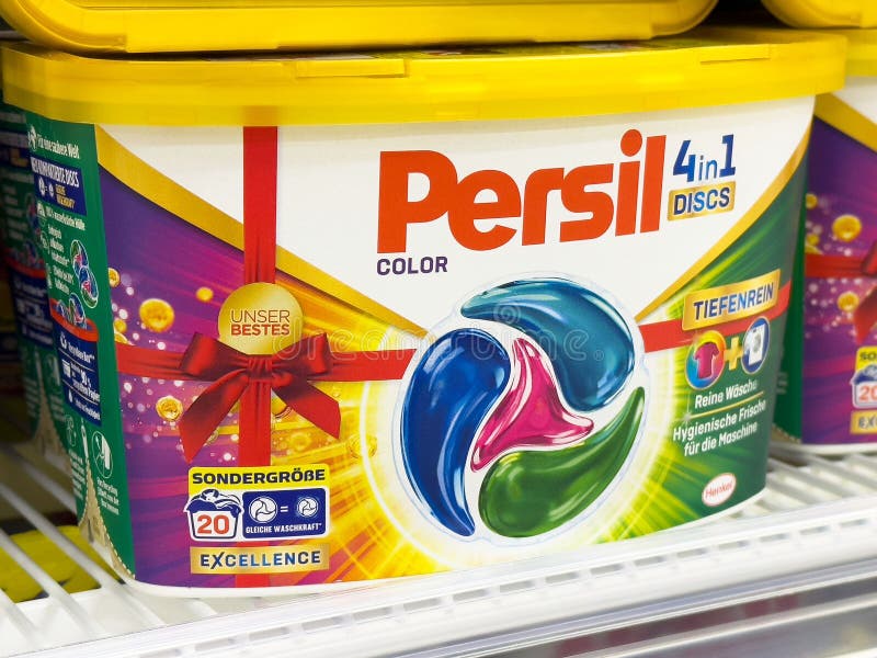 Persil 4in1 laundry discs in yellow container on store shelf stock image