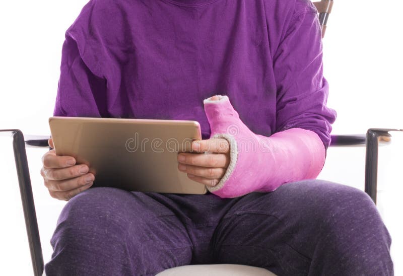 Person with Arm Cast Using an Accessible Tablet Stock Photo Image of