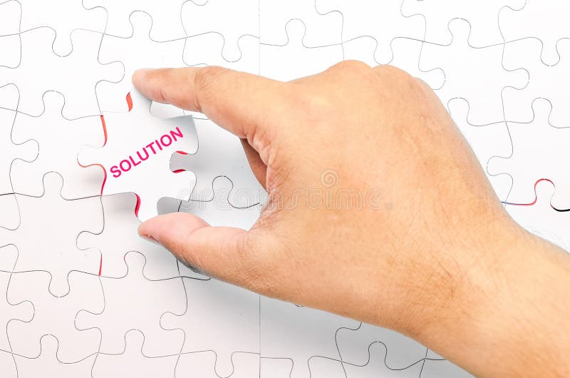 Person fitting the last puzzle piece.Concept image of problem solution. Person fitting the last puzzle piece.Concept image of problem solution