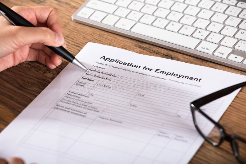 Person Filling The Employment Application Form royalty free stock image