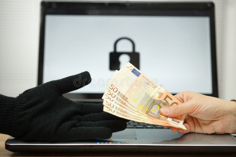 Person is giving money to computer hacker to decrypt files, comp stock photography